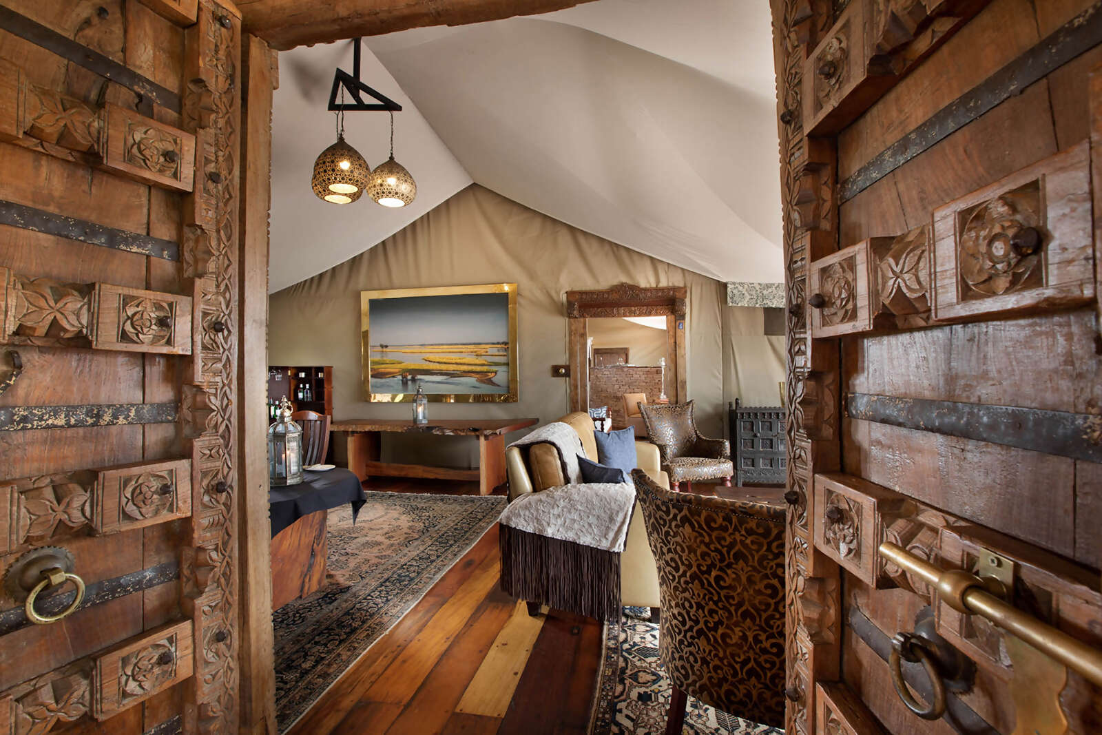 08Great-Plains-Zanji-Suite-at-Tembo-Plains-lounge-from-bedroom.jpg