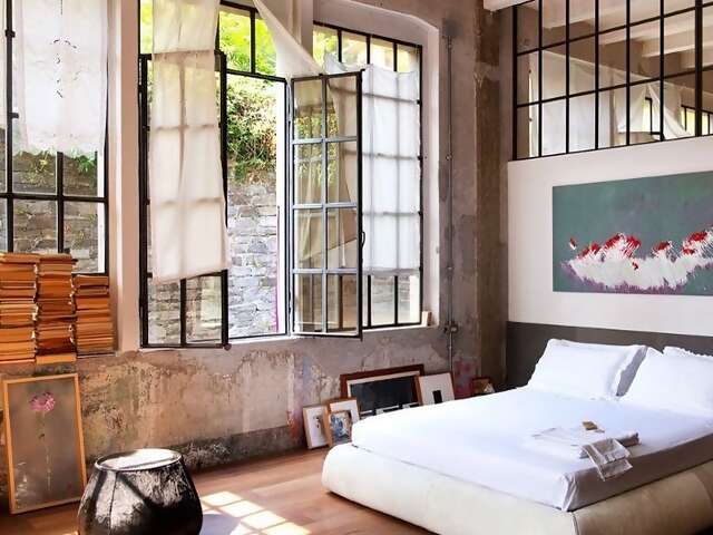 With 13-foot high ceilings and wide iron windows, Superhost Marco’s Airbnb Plus home is the canvas for his creativity